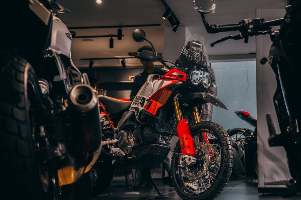 A stylish display of adventure motorcycles in a showroom in Bengaluru, India.
