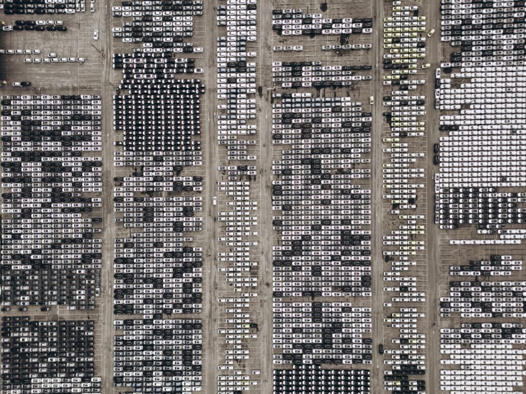 High-angle aerial shot of a massive car parking area, filled with vehicles in Brazil.