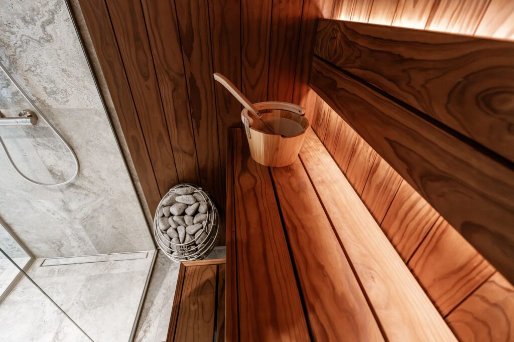 Explore a sleek, modern indoor sauna featuring wooden design elements and a minimalist aesthetic for ultimate relaxation.