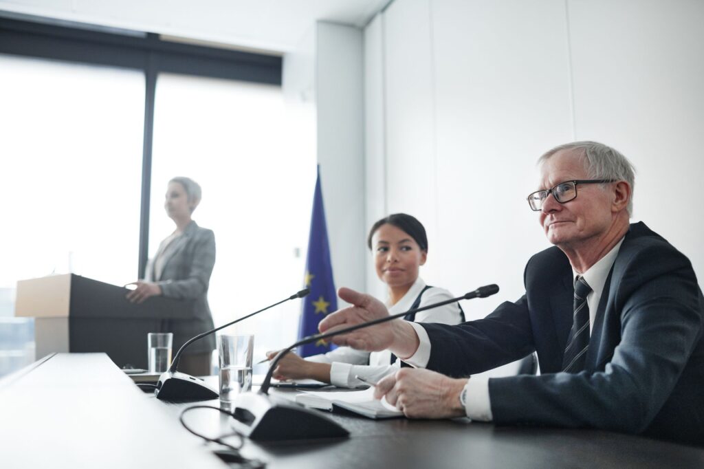 Panelists at an EU conference discussing law and diplomacy.