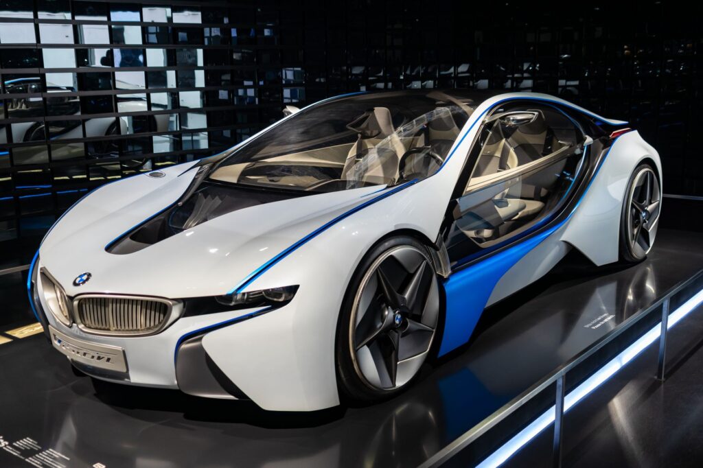 Stunning white luxury sports car displayed in a Munich showroom, exemplifying modern automotive design.